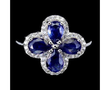A 925 silver ring set with oval cut sapphires and white stones, ring size N.