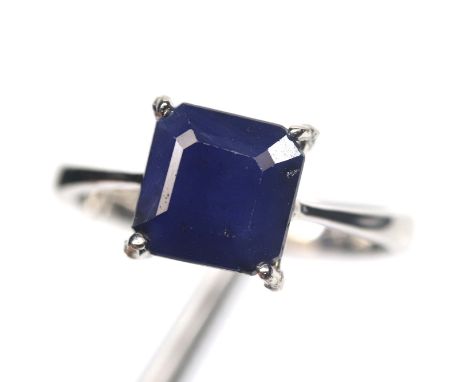 A 925 silver ring set with a step cut sapphire, ring size N.5.
