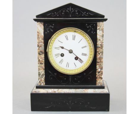 A 19thC slate and marble striking mantel clock, H. 27cm.