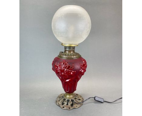 An early 20thC glass oil lamp style table lamp, H. 60cm.