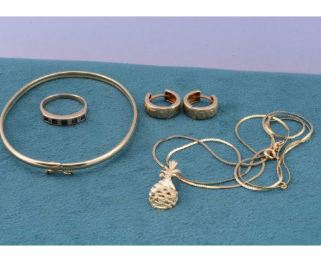 A small quantity of 14ct continental gold, including an oval bangle, a pair of hoop earrings, a gem set dress ring, ring size