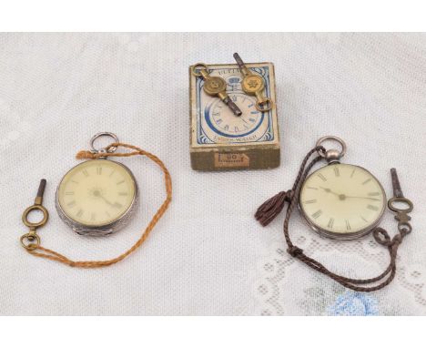 Two late 19th Century continental open faced fob watches, both with white enamel dials with roman numerals, one with engraved