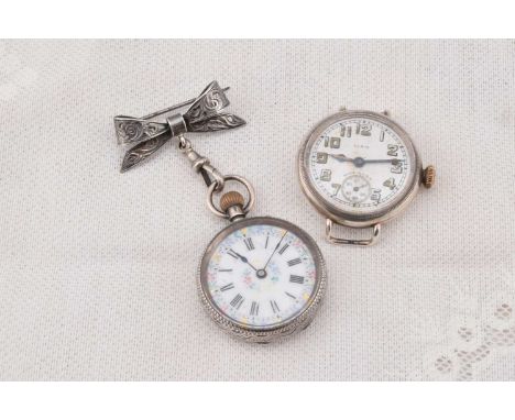 An early 20th Century continental white metal lady's fob watch, the white enamel dial with polychrome floral decoration and r
