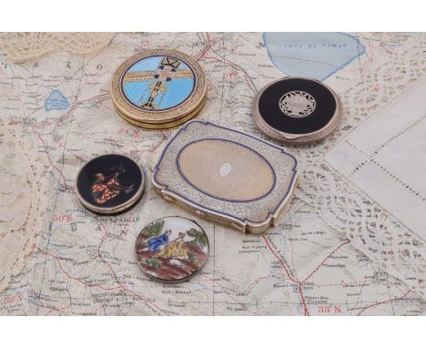 Five continental compacts, a circular silver black ground example with central pierced floral basket, early 1920s Austria Ste