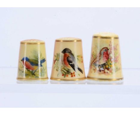 A Royal Worcester porcelain hand painted thimble, and 2 others each decorated with a bird (3)