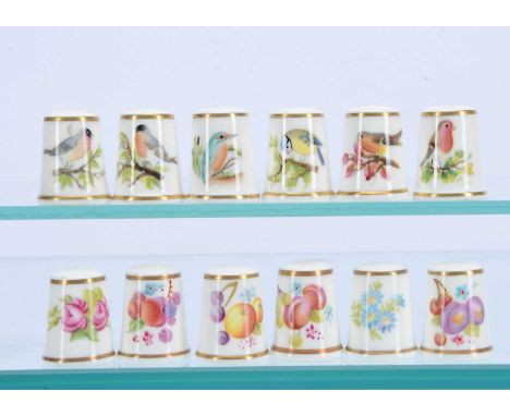 A collection of 12 Royal Worcester porcelain hand painted thimbles, by various artists such as Meredith Wardron, Walter and o