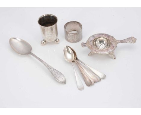 A small group of Swedish and continental items, including a tea strainer on stand, a napkin ring, a Christening beaker, and s
