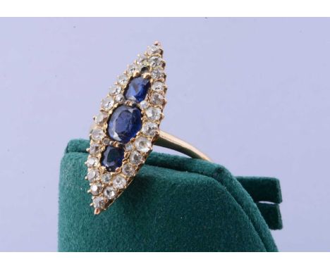 A Victorian navette shaped sapphire and diamond dress ring, the central sapphire having chip to underside, surrounded by old 