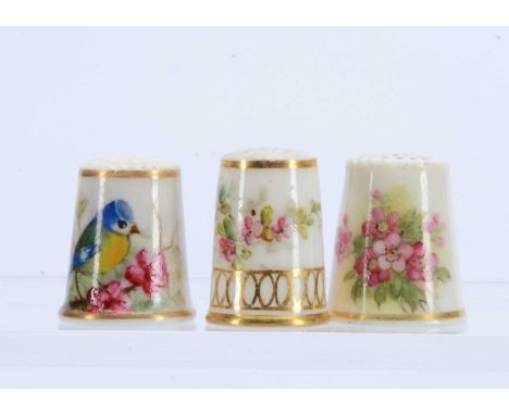 Three hand painted porcelain thimbles, 2 from Royal Worcester, each with a receipt from the Thimble Society (3)