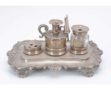 A William IV silver ink well stand by Matthew Boulton, the shaped base with three supports for a 'go to bed' chamber stick an