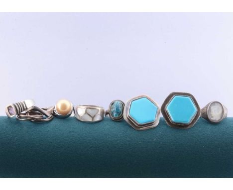A collection of white metal and silver dress rings, and clip earrings, including a pair of hexagonal turquoise style ear clip