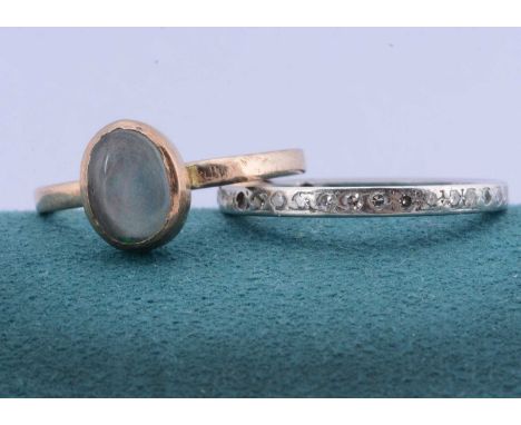A white metal diamond eternity ring, central part of a night and day example, ring size N, 1.8g together with a 9ct gold gem 