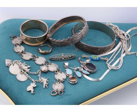 A quantity of silver jewellery, including two silver bangles, a pair of opal earrings, a Citrine drop pendant, a mother of pe
