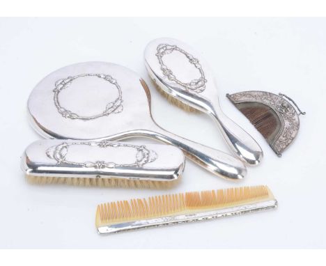 A part four piece dressing table set and an interesting antique comb, the silver plated copper comb set with rose cut stones 