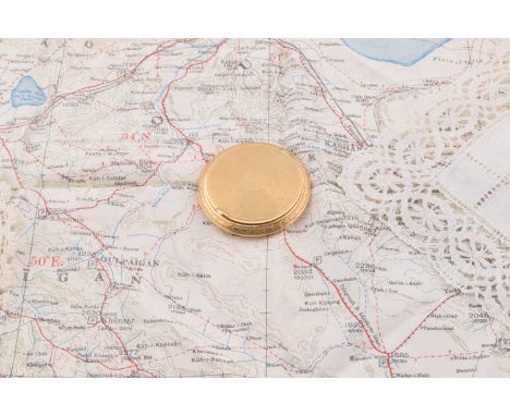 A French silver gilt early 20th Century circular powder compact, engine turned design, hinged lid, inner rim having French st