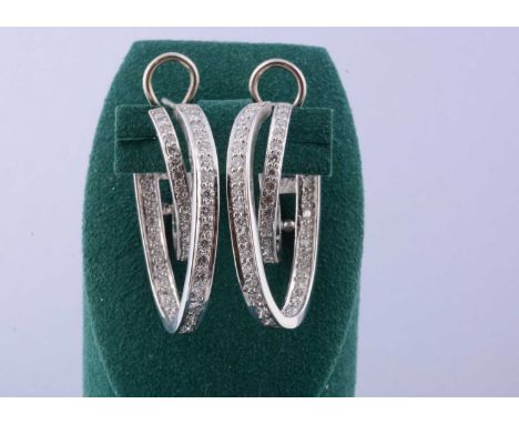 A pair of continental 18ct gold diamond hoop earrings, approximately 44 brilliant cuts in channel settings to each earring, 3