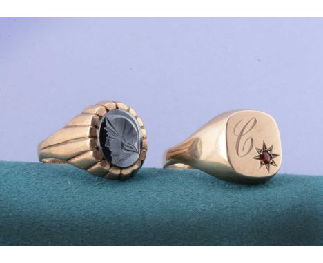 Two 9ct gold gentleman's signet rings, a haematite intaglio ring of classical warrior profile, ring size T and a garnet engra