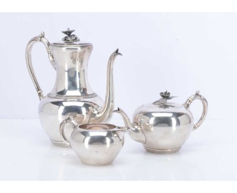 A c1920s Dutch three piece part tea set, comprising teapot, milk jug and hot water pot, 39.88 ozt, the water pot with ivory s