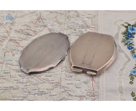 Two silver oval shaped compacts, both of engine turned design, flattened end example monogrammed ABL or similar, Birmingham 1