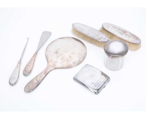 An Art Deco silver cigarette case and a six piece dressing table set, the case 3.18 ozt, together with a cut glass pot with s