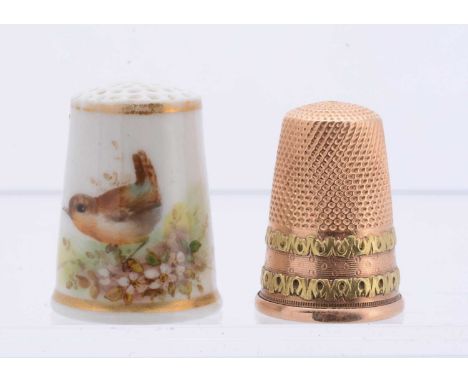 A gold thimble and a Royal Worcester porcelain hand painted example, the gold thimble 4.8g, sold with the original receipt (2