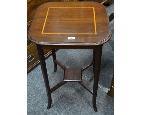 An Edwardian mahogany hall/lamp table with satinwood stringing throughout, tapering out splayed legs,small square undertier, 