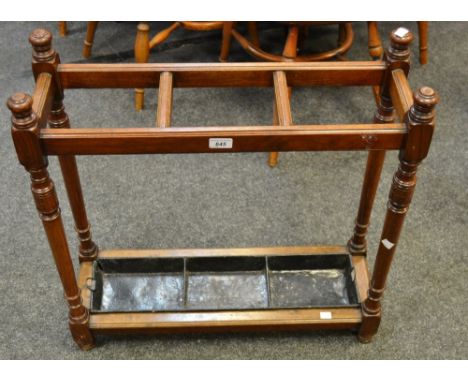 A Victorian oak stick stand, turned supports, divided tin drip tray