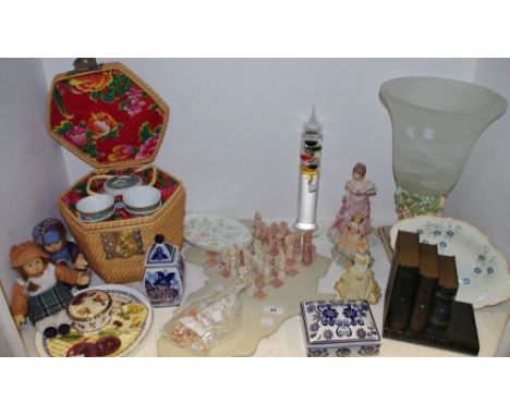 A novelty soapstone chess and solitare set, shape as a map of Africa; a chinese tea for two in a wicker basket; a barometer/h