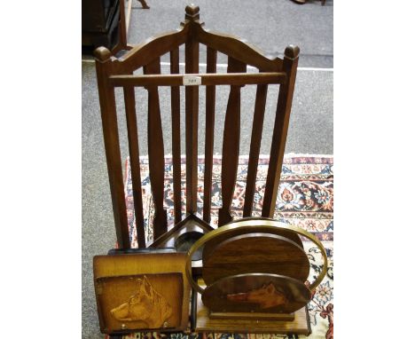 An oak corner stick stand; an oak brass two partition magazine stand with embossed dog's head decoration; a conforming wall m