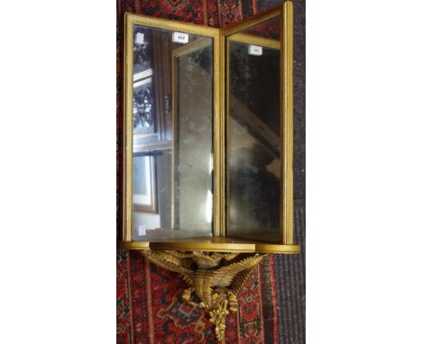 A gilt corner display shelf, mirror backed, fern and bow bracket, approx 78cm in height