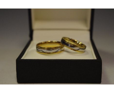 A pair of matching 18ct white and yellow gold wedding bands size R 1/2 and size M, 9.5g gross  