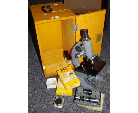 A microscope model L-L-201, some slides, boxed with key.