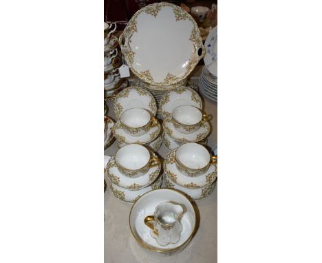 A De Haviland HG Stephenson pattern part tea set, transfer printed with floral swags, picked out in gilt, comprising eight cu