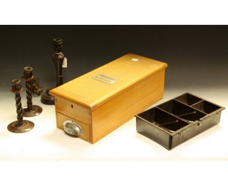 An early 20th century cash box with bell; a Bakelite table lamp with ashtray; a cash tray; a pair of candlesticks