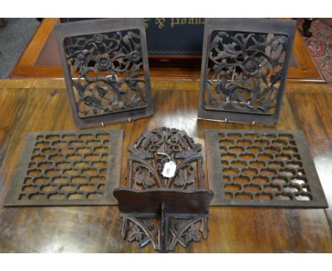 A pair of Oriental carved and pierced wooden panels, birds and flowers, 31cm x 25cm; another pair, pierced honeycomb grills, 