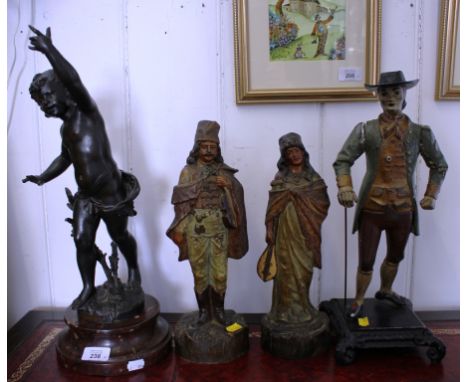 After Ferrand La Foret A spelter figure of a naked boy, hand aloft, on a red marble base, 46cm high A pair of ceramic figures