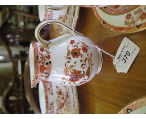 A Wedgwood tea service for ten place settings, pattern Y64, with red, gold and black floral decoration