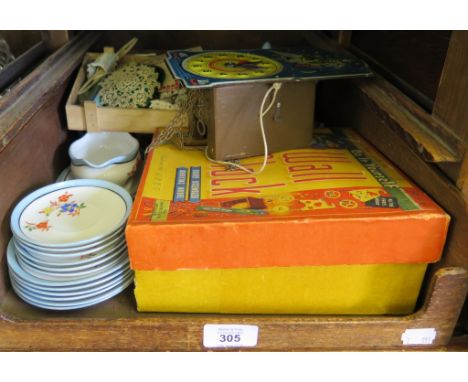 A Codeg 'Do-It-Yourself' wall clock, boxed, and another unboxed, a miniature tea service and various game accessories 