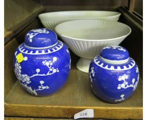 A Wedgwood plain white planter with reeded sides, another similar, two ginger jars and covers