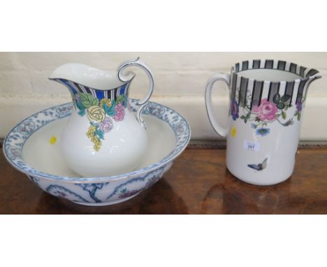 A Wilkinson Ltd floral and butterfly decorated wash jug, another wash jug, a wash bowl, slop bucket and green glaze jardinier