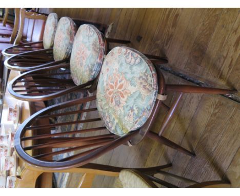 A set of four Ercol Windsor style dining chairs, labelled and stamped (4)
