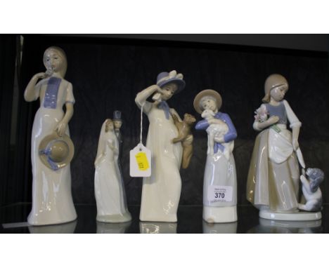 A Nao figure of girl with a dog, 23cm high, another Nao figure of a wedding couple and three Rex of Valencia figures (3)