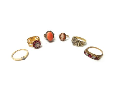 A 9ct gold, red and colourless gem set cluster ring, with pierced decoration, London 1972, a 9ct gold, red and colourless gem