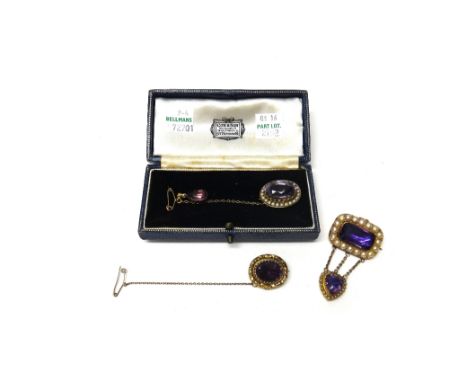 A gold rectangular brooch, mounted with a foil backed amethyst to the centre, in a surround of half pearls and with a foil ba