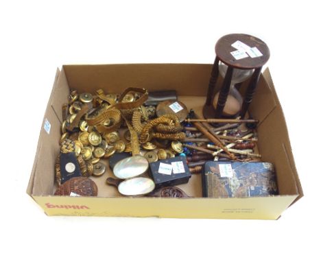 A quantity of small collectables, including; naval brass buttons and gauntlets, wooden and bone bobbins, a wooden framed glas