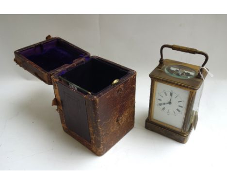 A French brass cased carriage clock, late 19th century, the white enamel dial detailed with Roman numerals, with two train mo