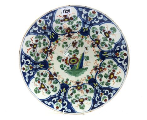 An English delftware polychrome charger, probably Bristol, circa 1760, foliate decorated and with painted blue mark to rear, 