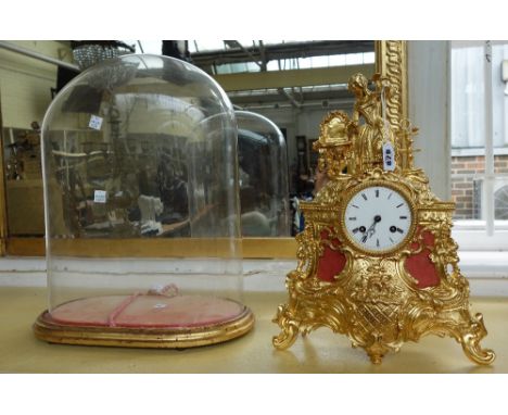 A French gilt metal mantel clock, 19th century, with figural surmount over a foliate and scroll cast case, with a 'Leroy' two