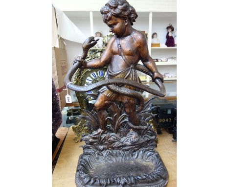 A Coalbrookdale cast iron stick stand, mid-19th century, modelled and cast with the infant Hercules wrestling a snake, with f