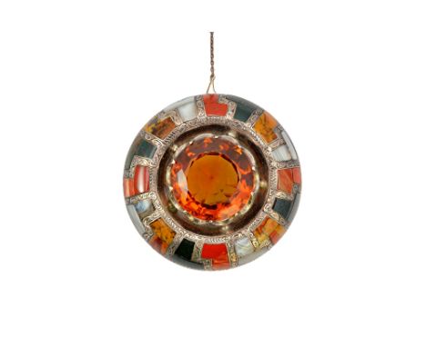 A Victorian silver, citrine and vary coloured agate set circular brooch, probably Scottish, claw set with the circular cut ci